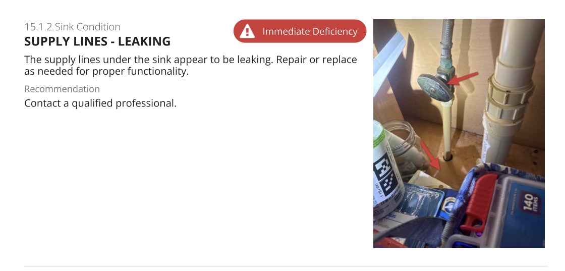 Immediate deficiency finding showing leaking supply lines under a sink with arrows marking the leak