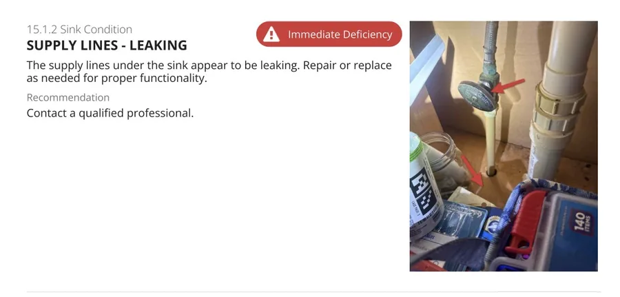 Immediate deficiency finding showing leaking supply lines under a sink with arrows marking the leak